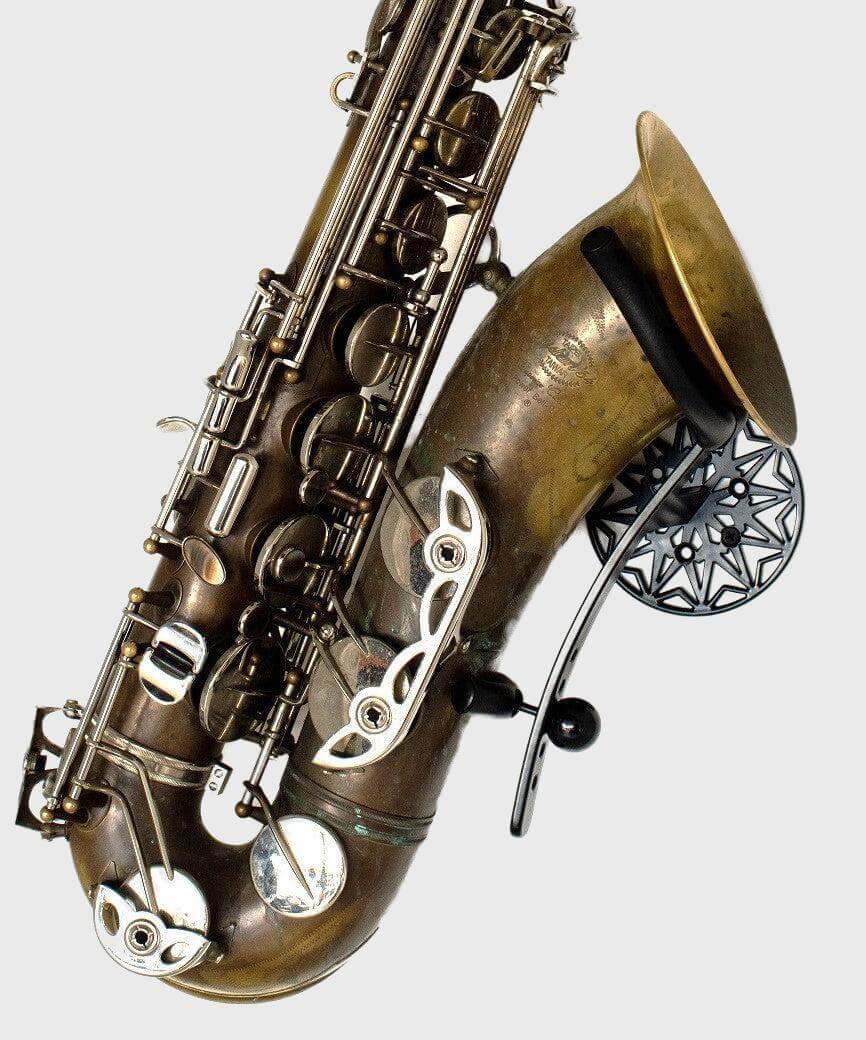 brass tenor saxophone in black wallmount on white wall product pic