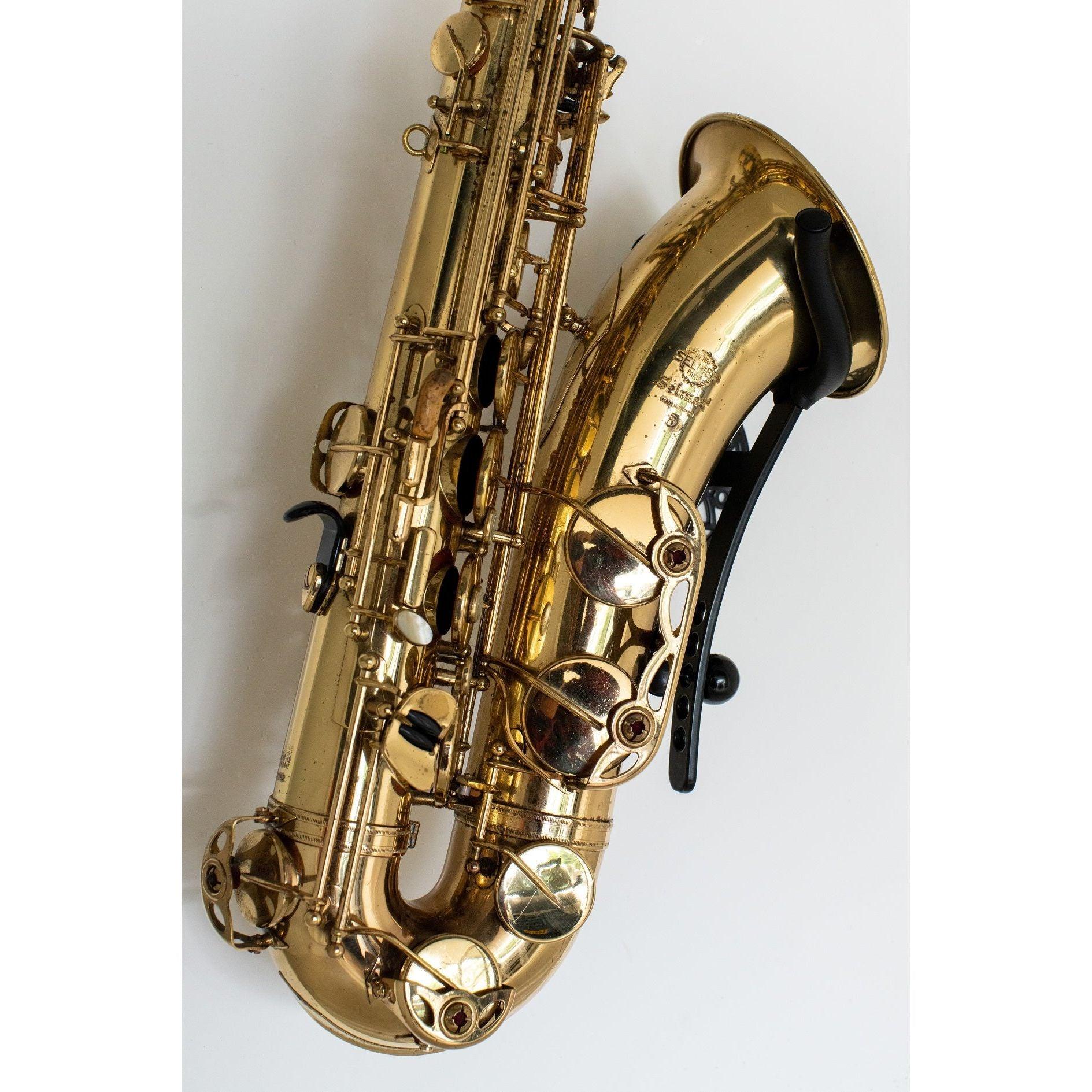 gold Selmer Mark 7 saxophone in wallmount Aztec on white wall by Locoparasaxo.com