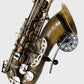 brass tenor saxophone in black wallmount on white wall product pic